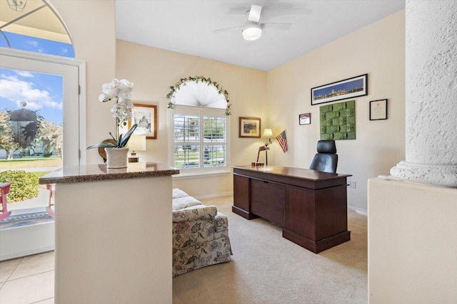 home office featuring ceiling fan and light colored carpet