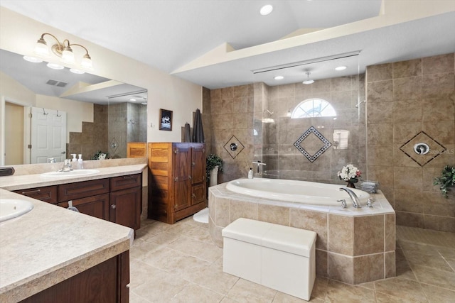 bathroom with tile patterned flooring, vanity, separate shower and tub, and lofted ceiling