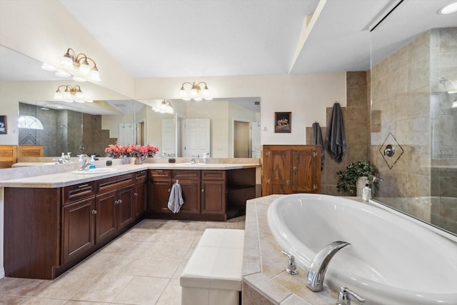 bathroom featuring shower with separate bathtub, vanity, and tile patterned floors