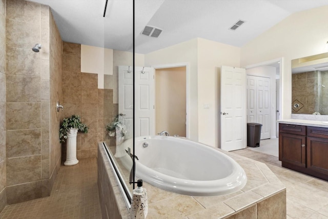 bathroom featuring tile patterned flooring, shower with separate bathtub, vanity, and vaulted ceiling