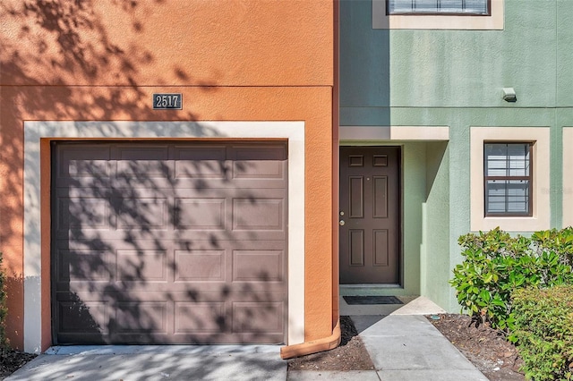 entrance to property featuring a garage