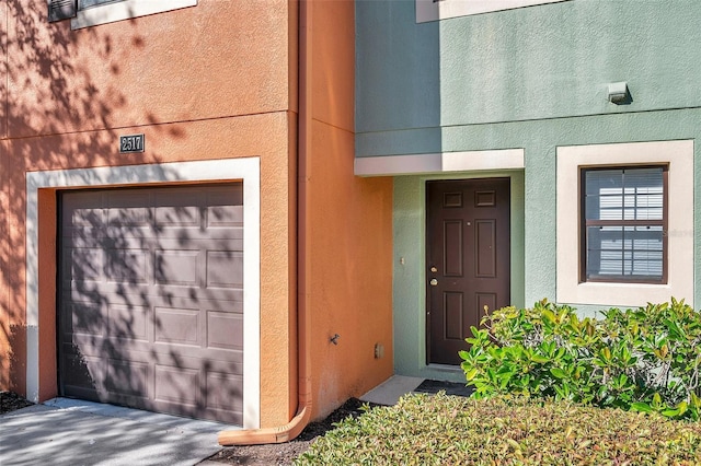 property entrance with a garage