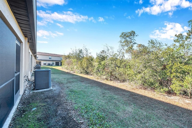 view of yard featuring central AC