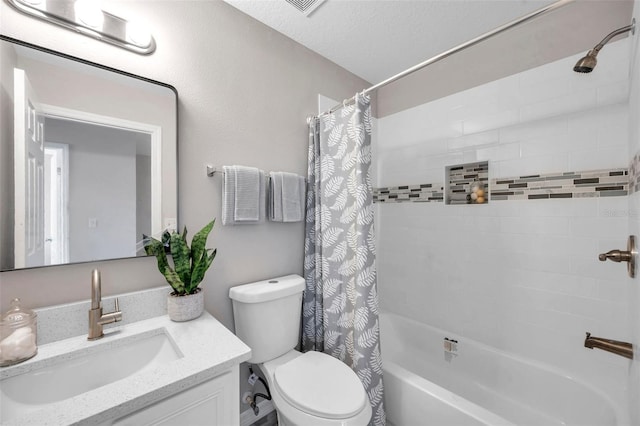 full bathroom featuring toilet, vanity, a textured ceiling, and shower / bath combo with shower curtain