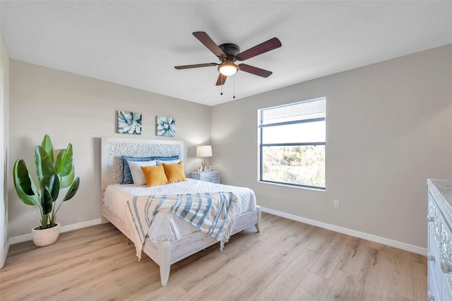 bedroom featuring ceiling fan and light hardwood / wood-style flooring