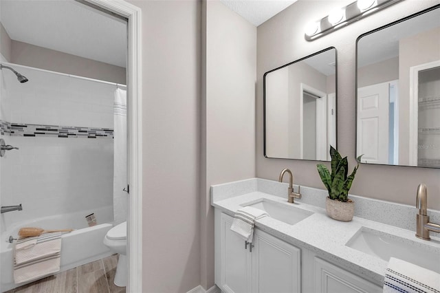 full bathroom with toilet, wood-type flooring, shower / tub combo with curtain, and vanity