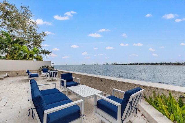 view of patio / terrace featuring a view of the beach and a water view