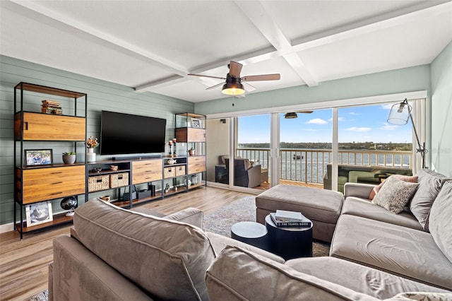 living room with hardwood / wood-style flooring, ceiling fan, wooden walls, coffered ceiling, and beamed ceiling