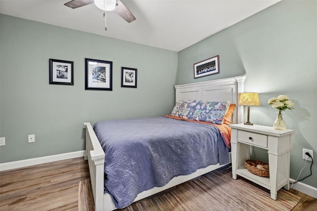 bedroom featuring ceiling fan and hardwood / wood-style floors