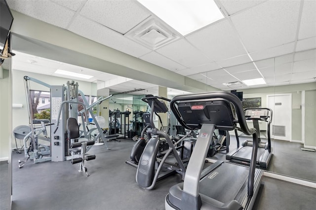 workout area featuring a drop ceiling