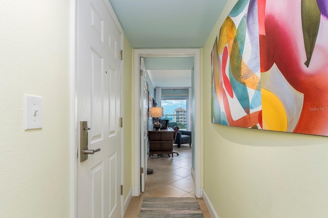 hallway with tile patterned floors