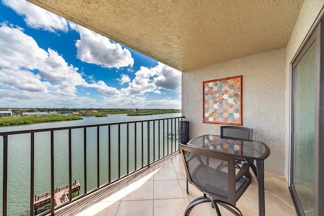 balcony featuring a water view