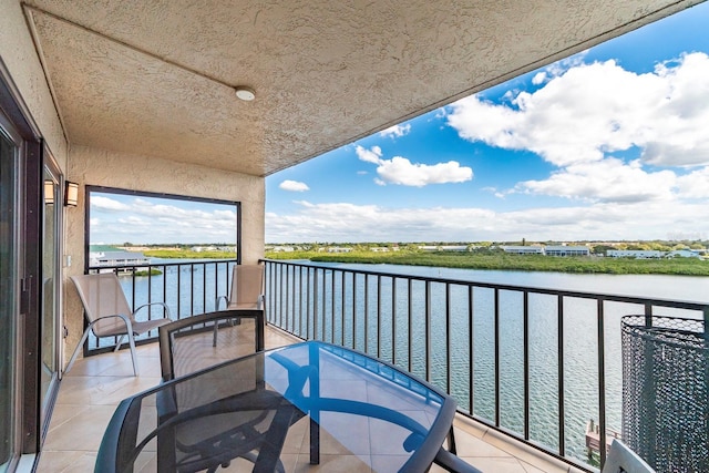 balcony featuring a water view