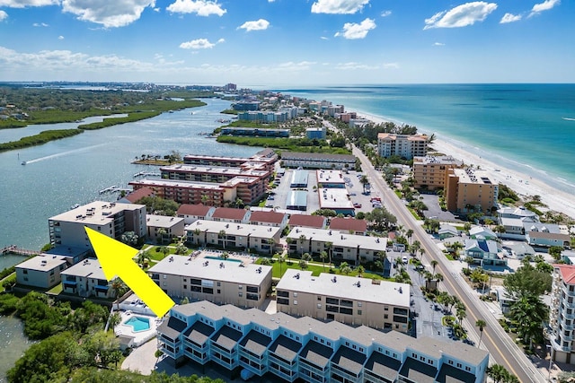 drone / aerial view featuring a water view and a view of the beach