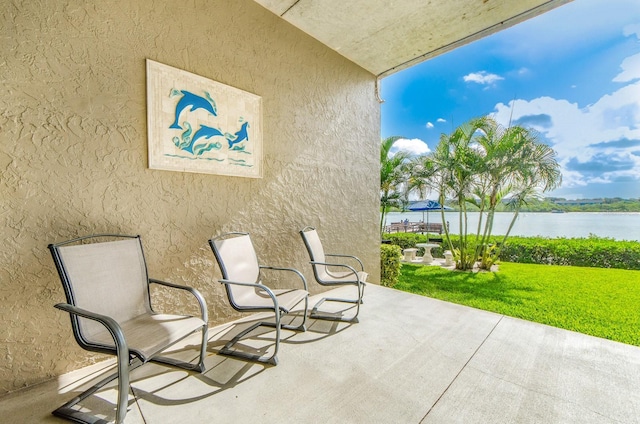 view of patio featuring a water view