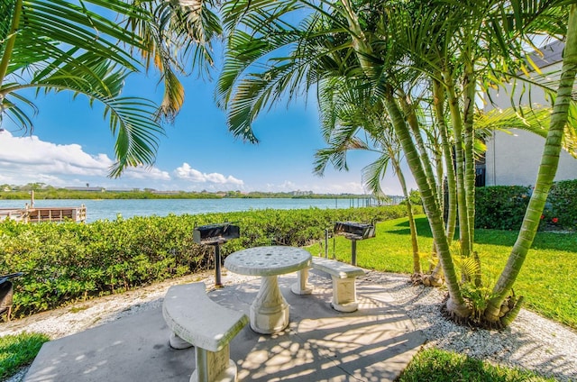 view of patio with a water view