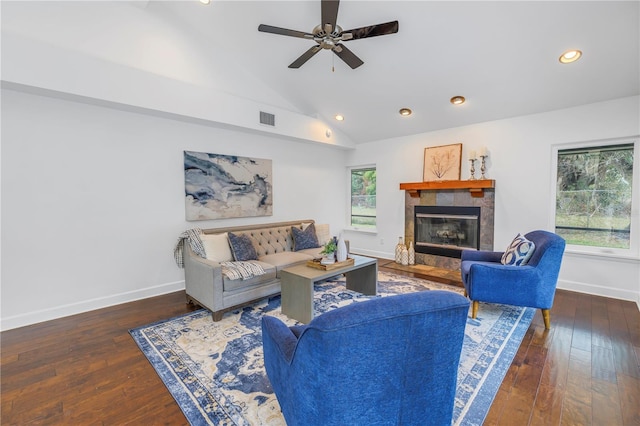 living room with ceiling fan, dark hardwood / wood-style flooring, a fireplace, and plenty of natural light