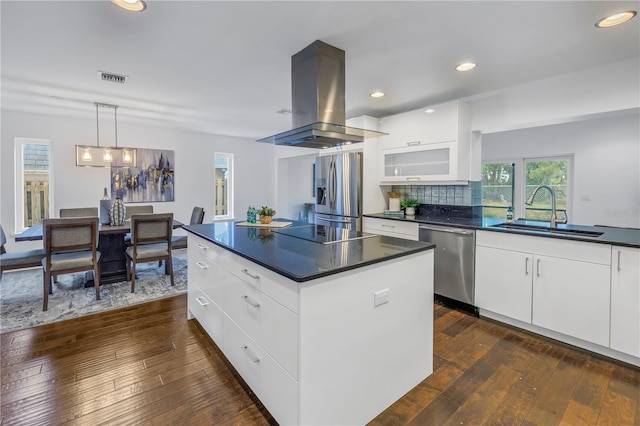 kitchen with sink, white cabinetry, appliances with stainless steel finishes, and island range hood