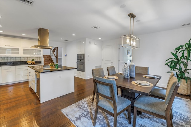 dining room with dark hardwood / wood-style flooring