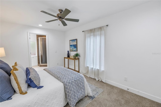 carpeted bedroom featuring ceiling fan and connected bathroom