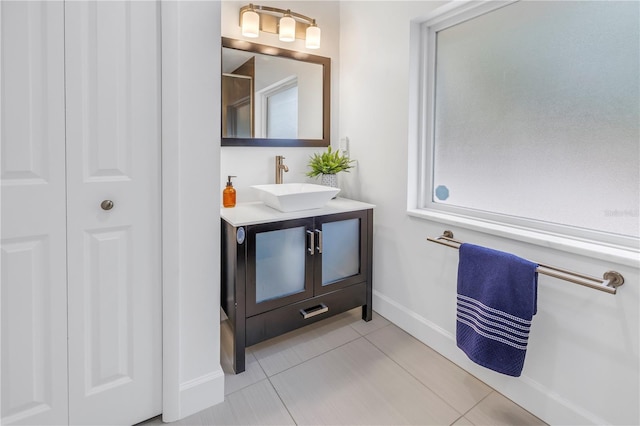 bathroom with tile patterned floors and vanity