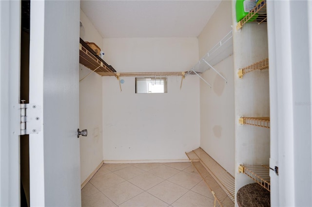 walk in closet featuring light tile patterned floors