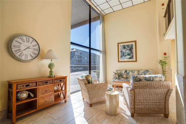 living area with floor to ceiling windows and a healthy amount of sunlight