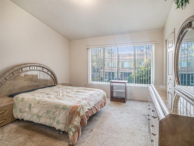 carpeted bedroom with a textured ceiling