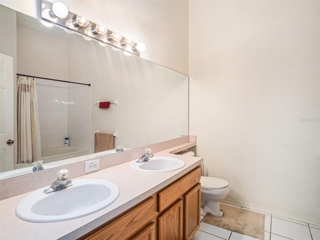 full bathroom featuring toilet, vanity, tile patterned floors, and shower / bath combo with shower curtain