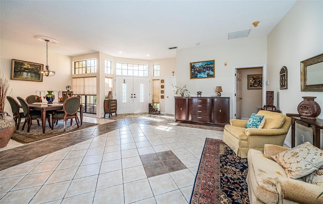 tiled living room with a towering ceiling