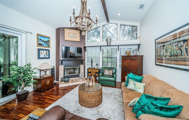 living room with a notable chandelier, dark hardwood / wood-style floors, a textured ceiling, and vaulted ceiling with beams