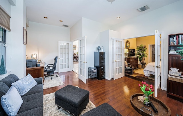 living room featuring dark hardwood / wood-style floors and french doors