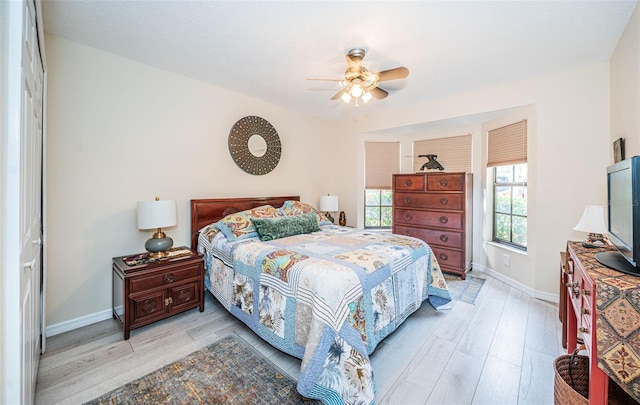 bedroom featuring light wood-type flooring and ceiling fan