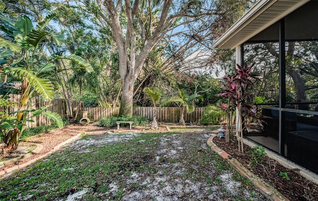 view of yard featuring a sunroom