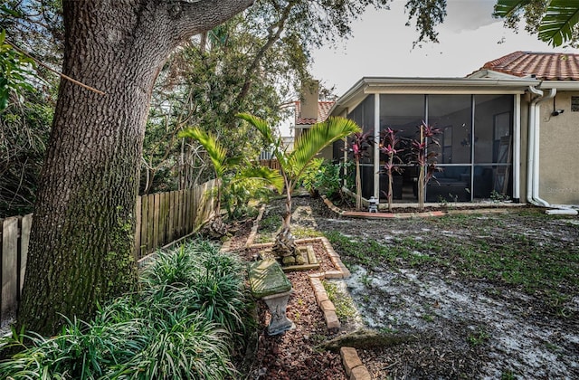 view of yard with a sunroom