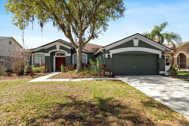 ranch-style home with a garage, a front yard, concrete driveway, and stucco siding