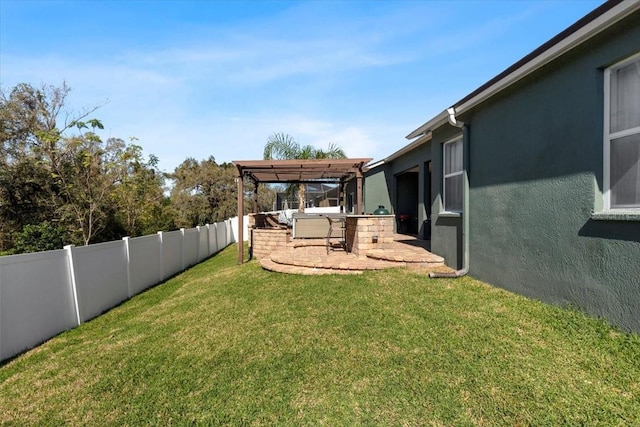 view of yard with a patio area, a fenced backyard, and a pergola