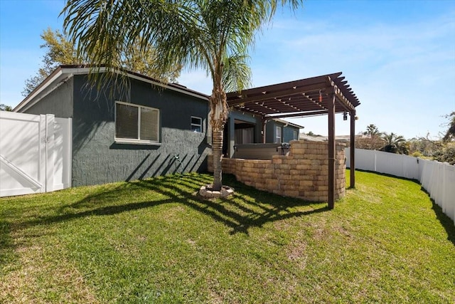 rear view of house with stucco siding, fence, a lawn, and a pergola