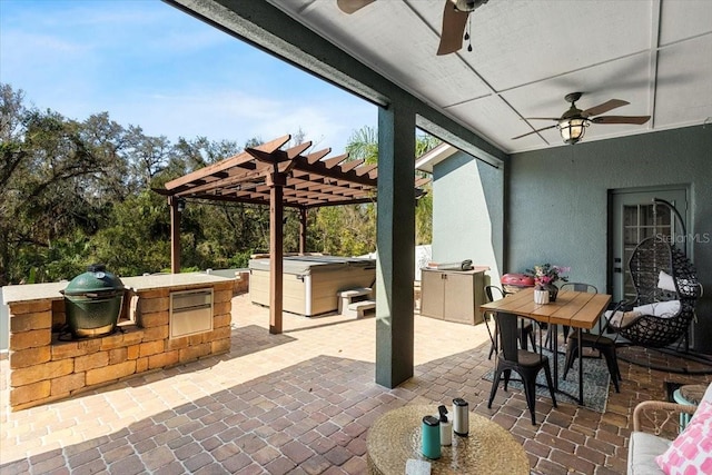 view of patio with outdoor dining area, area for grilling, a ceiling fan, grilling area, and a pergola