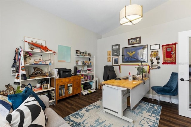 office space with vaulted ceiling, baseboards, and wood finished floors