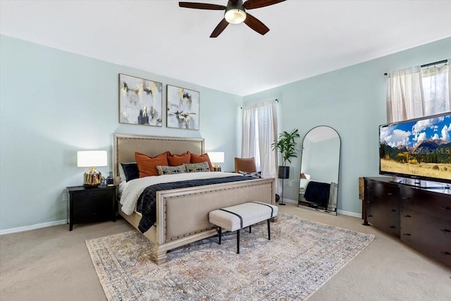 bedroom featuring carpet floors, baseboards, and a ceiling fan