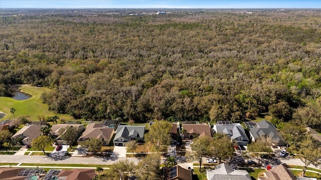 birds eye view of property with a residential view and a forest view