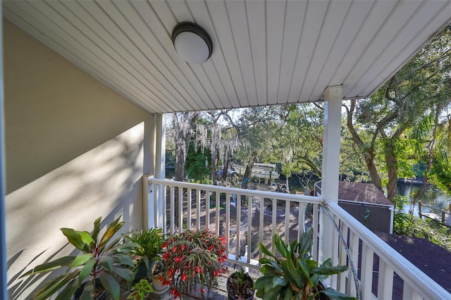 balcony featuring a water view