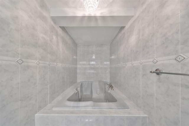 bathroom with tiled tub