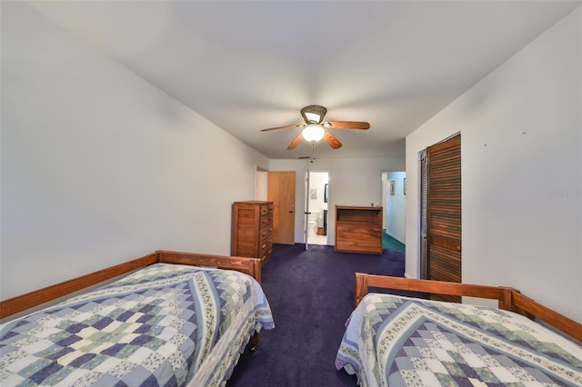 carpeted bedroom featuring a closet and ceiling fan