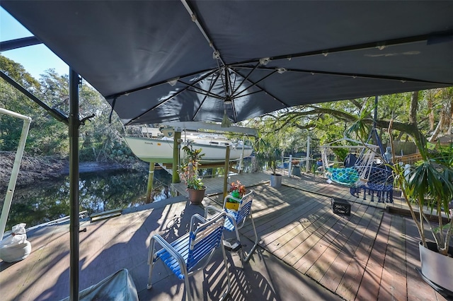 wooden terrace with a water view