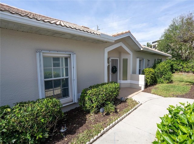 property entrance with a patio area