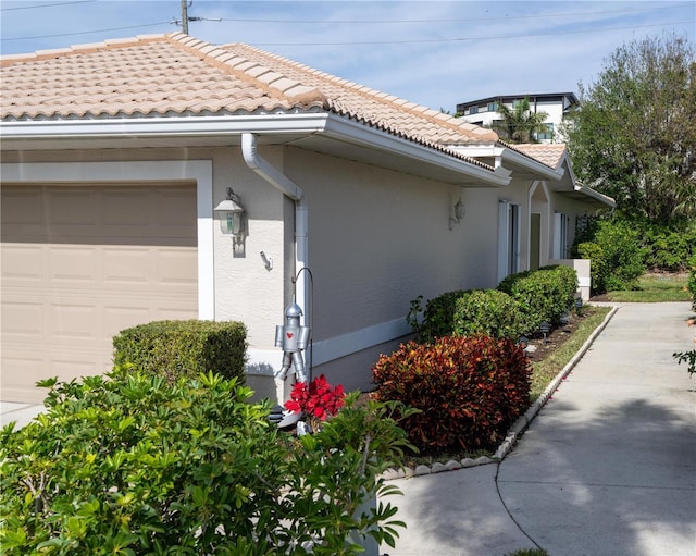 view of property exterior with a garage