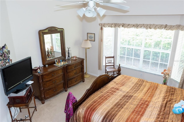 bedroom with light carpet and ceiling fan