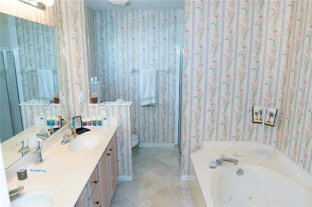 bathroom with vanity, a tub to relax in, tile patterned flooring, and toilet